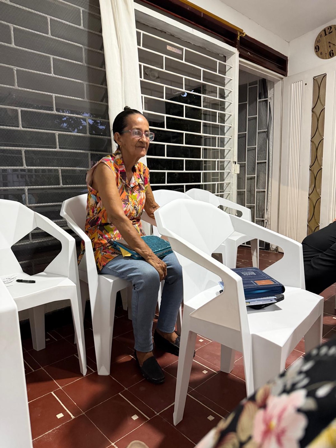 A church member visiting on the porch