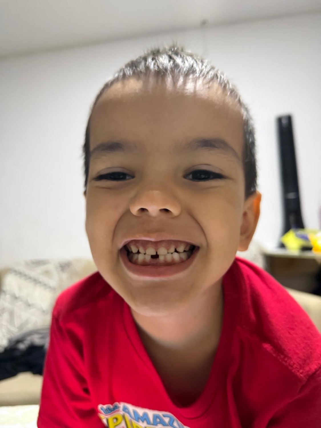 Neal grinning with a missing tooth